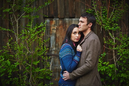 Amorous couple in casualwear having romantic date outside