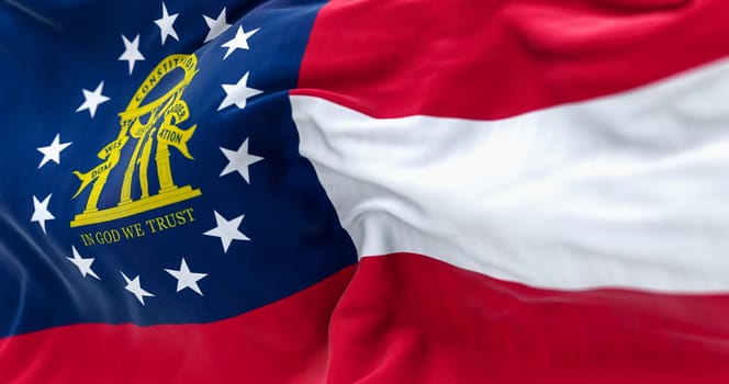 Close-up view of the Georgia state flag waving in the wind. Georgia is a federated state of the United States of America. Fabric textured background. Selective focus. Realistic 3d illustration