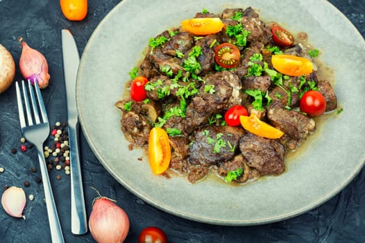 Chicken liver stewed with mushrooms and tomatoes. Georgian recipe