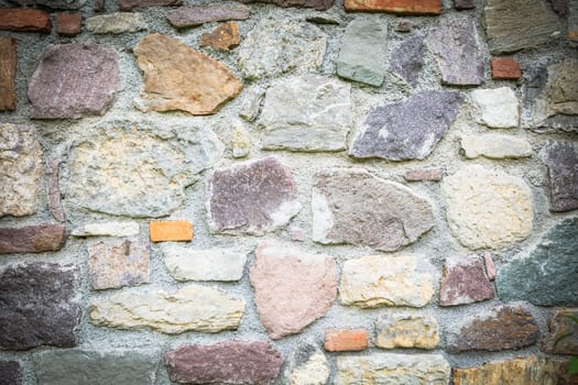 Old brick wall, old texture of withe and red stone blocks closeup