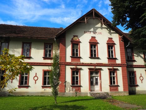 Banja Koviljaca, Serbia, Guchevo, Loznica, September 30, 2022. Rehabilitation center with sulfur and iron mineral waters. Old unrestored two-story villa buildings with a lawn, Banja Koviljacha.