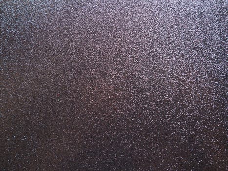 Purple shiny bokeh abstract background. Blue - lilac paper with sparkles. Festive backdrop.