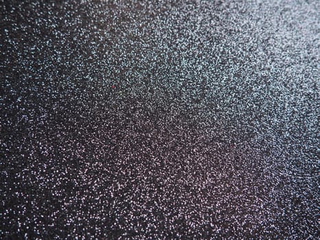 Purple shiny bokeh abstract background. Blue - lilac paper with sparkles. Festive backdrop.