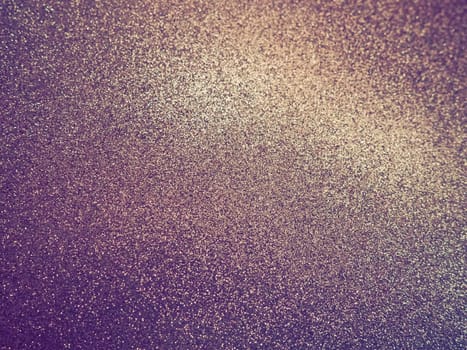 Purple - yellow shiny bokeh abstract background. Blue - lilac -pink paper with sparkles. Festive backdrop.