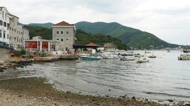 Meljine Herceg Novi, Montenegro, August 12 2022 Boats, yachts and ships are at anchor. Moored ships in the parking lot. Adriatic Sea Mediterranean. Travel business. Sea travel and sports. White boats.