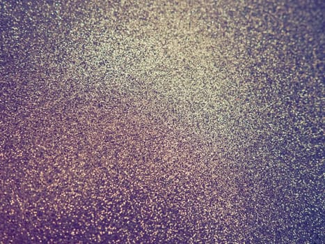 Purple - yellow shiny bokeh abstract background. Blue - lilac -pink paper with sparkles. Festive backdrop.
