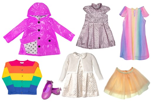 Collage set of clothes for a little girl isolated on a white background. The collection of stylish dresses, a short skirt, a sweater, a rain jacket, jeans and shoes.