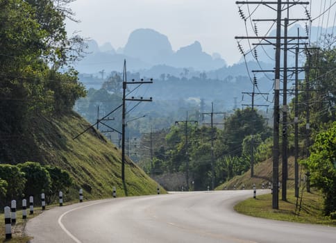 Asphalt curve road with mountain background