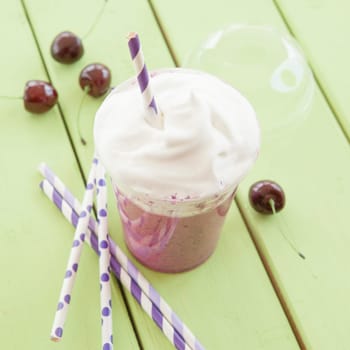 Smoothie from red fruit with whipped cream