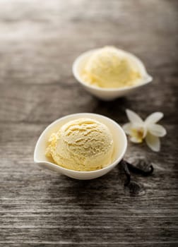 Vanilla Ice cream on a wooden background close up