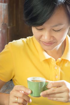 Customer enjoying hot espresso shot, stock photo