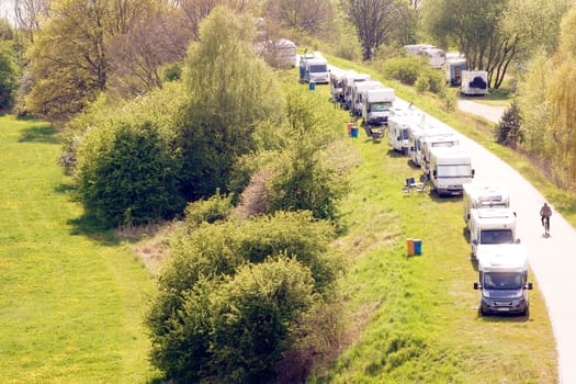 Dömitz,Germany – May 02,2015: Camping cars camp on the winding dike of the river Elbe in fine weather on May 2,2015 in Dömitz.