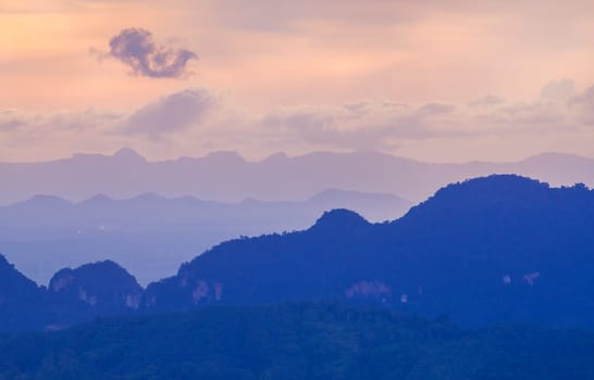 View of landscape nature and mist and mountain with sunlight and sunset or sunrise in morning light, Abstract and pattern of cloud sky Calming coral, Orange, Trend color of the year background