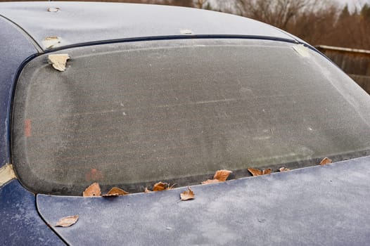 frozen windshield of a passenger car in winter. High quality photo