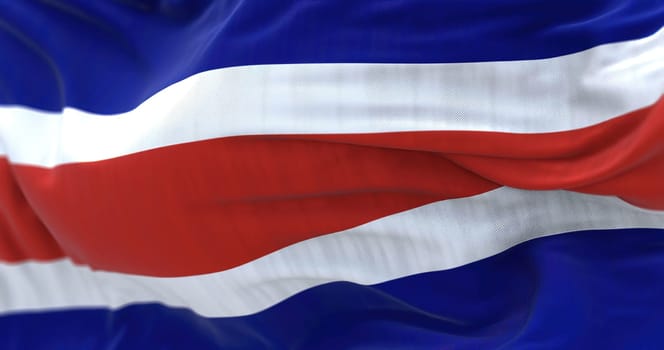 Close-up view of the Costa Rica national civil flag waving in the wind. The Republic of Costa Rica is a State of Central America. Fabric textured background. Selective focus. Realistic 3d illustration