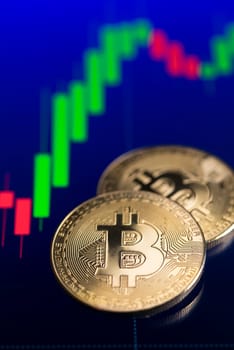 Coins with bitcoin logo drop at bear market. Trends in bitcoin exchange rates. Rise and fall charts of bitcoin.
