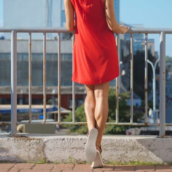 Muscular female legs posing  outdoor.