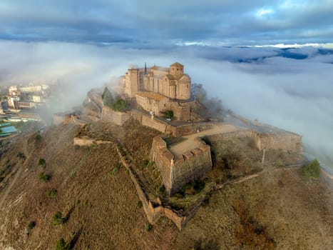 Cardona castle is a famous medieval castle in Catalonia. Between very dense fog that hides the city