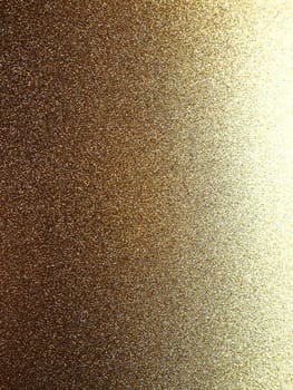 Gold close up. Golden glitter texture background. Sparkling glitter wrapping paper with sequins and sparkles. Festive golden bokeh and glitter. Beautiful background. Bokeh light of gold glitters.