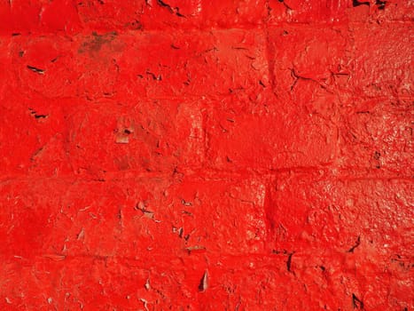 Red wall and texture background. Large bricks painted with glossy oil scarlet paint