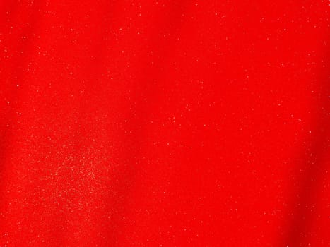 Red background, arched scarlet. Nice holiday color. Background with shimmer, gradient, white dots. Photograph of sparkling colored paper