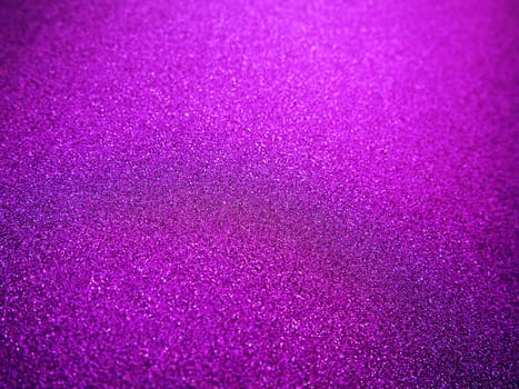 Purple shiny bokeh abstract background. Pink - lilac paper with sparkles. Festive backdrop