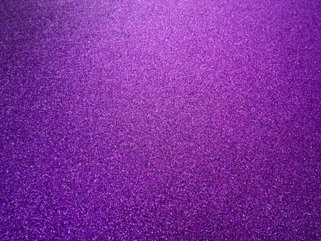 Purple shiny bokeh abstract background. Pink - lilac paper with sparkles. Festive backdrop