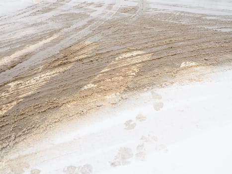 Snow, ice, slush and winter mud at a pedestrian crossing. The air temperature is about 0. Difficult driving conditions. Braking distance of the car. Traffic Laws. Infrastructure and road services.