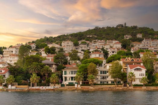 View of the mountains of Kinaliada island from Marmara Sea, with traditional summer houses and boats, Istanbul, Turkey