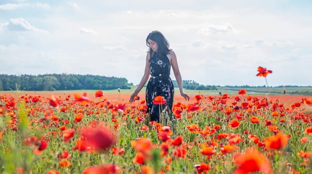 sensual young woman in poppy field