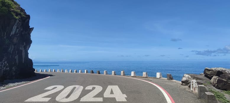 The New year 2024 road to future ahead word on asphalt road