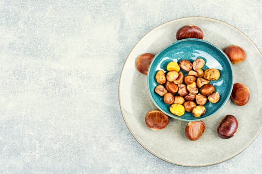 Peeled roasted chestnuts, appetizing dessert. Caramelized roasted chestnuts. Close up