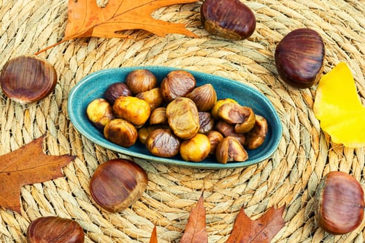 Peeled roasted chestnuts, appetizing dessert. Caramelized roasted chestnuts. Close up