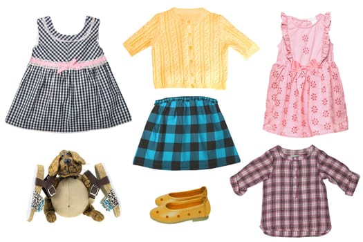 Collage set of little girl summer clothes isolated. The collection of dresses, skirt, sweater, blouse, shoes and a funny dog with sandales. Fashionable kids outfit.