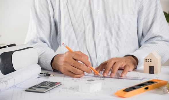 Architect workplace. Architectural building design and construction plans with blueprints paper project plans VR glasses, designing man edit a building or architecture with ruler, technology industry
