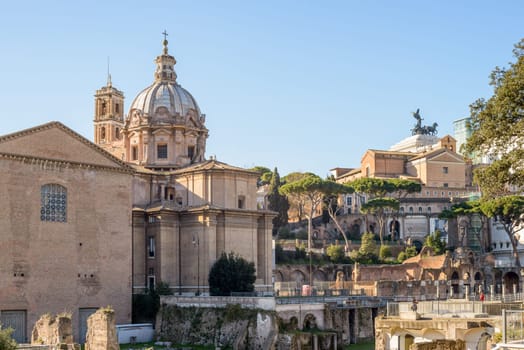Ruins buildings and statue in the foro romano in Rome italy