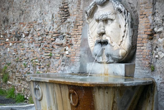 A fountain outside The garden of the Oranges