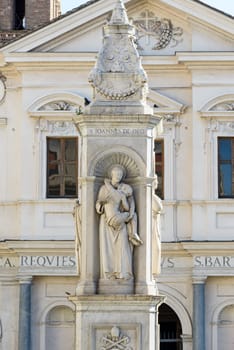 statue and church on the tiberina isle in rome italy