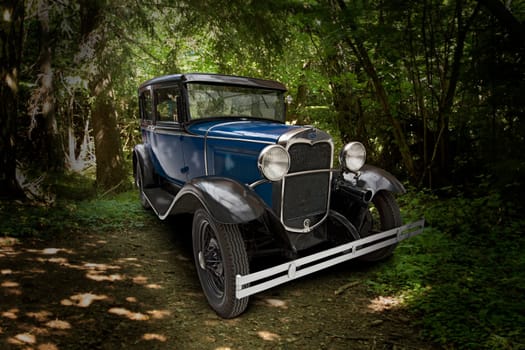 1930 Ford Model A on forest path on a beautiful summer day
