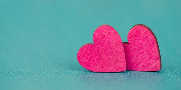 Pink hearts on a turqouise background, valentine greeting card, mothers day and birthday wishes, love symbol