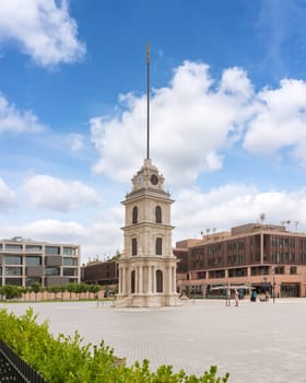 Istanbul, Turkey - August 31, 2022: Recently restored Nusretiye Clock Tower, aka Tophane Clock Tower, with background of Galata Port, situated in Tophane, a neighborhood in Beyoglu district