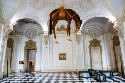 Rivoli, Italy - June 2022: Maurizio Cattelan provocative contemporary art - Novecento