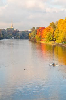 Turin, Piedmont Region, Italy - Circa November 2021: landscape in autumn with Po' river and blue sky.