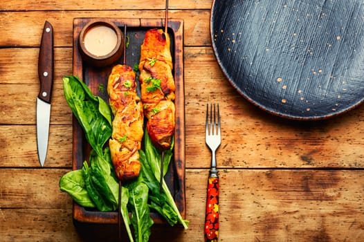Appetizing chicken meat with peanut butter sauce, chicken breast fried on skewers. Souvlaki