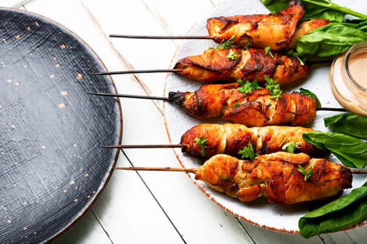 Appetizing chicken meat with peanut butter sauce, chicken breast fried on skewers. Souvlaki