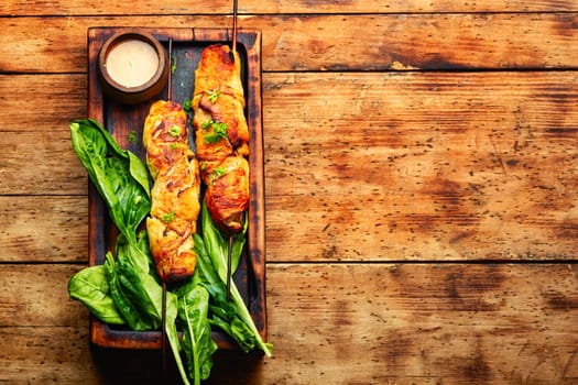 Tasty chicken meat, chicken breast roasted on wooden skewers. Kebabs