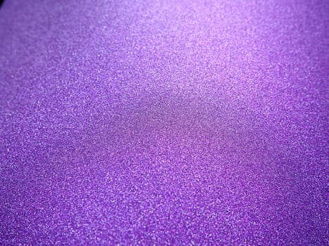 Purple shiny bokeh abstract background. Pink - lilac paper with sparkles. Festive backdrop