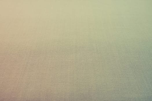 pale background fabric texture. A piece of woolen cloth is neatly laid out on the surface. Weave and textile texture. Dress fabric or for kitchen needs, tablecloth or curtains, close-up. Dash.