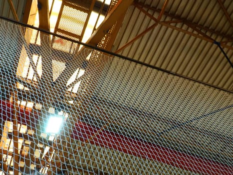 The roof of a hangar, a production hall or a sports hall. Metal structures, beams, supporting elements. Ventilation systems in large halls and rooms. Skylights. Industrial interior