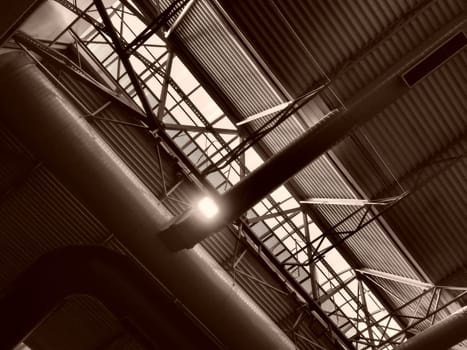 The roof of a hangar, a production hall or a sports hall. Metal structures, beams, supporting elements. Ventilation systems in large halls and rooms. Skylights. Industrial interior
